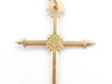 an image of a gold cross with a bird on it