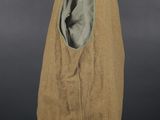 an image of a brown vest on a mannequin stand
