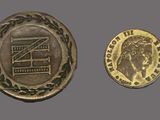 a close up of a coin and a coin on a gray surface