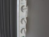 an image of a wall mounted electrical outlet in a bathroom