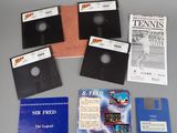 four floppy disks and a book on a table