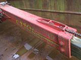 a red machine that is sitting on the ground