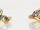 two gold and silver rings with diamonds on a white surface