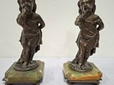 paire de figurines en bronze représentant un garçon et une fille, sur des socles en marbre