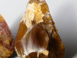 two pieces of rock that are sitting on top of a table
