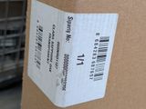 a box with a barcode on it sitting on a shelf