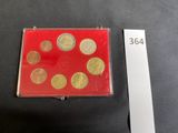 a picture of a red box with gold coins