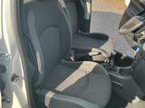 the interior of a car with the door open and the seats down