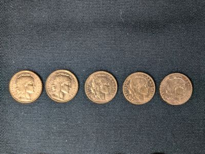 a close up of a row of coins on a blue cloth