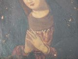 an old painting of a woman praying with her hands clasped