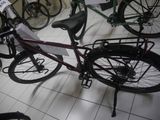 a bicycle that is sitting on the floor in a room