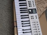 a keyboard that is sitting on top of a cardboard box