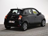 a picture of a small black car parked in a garage