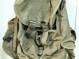 a backpack hanging on the wall by the door