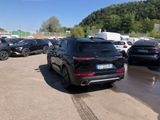 many cars parked in a parking lot in a lot
