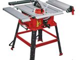 a red table sawing machine sitting on top of a table