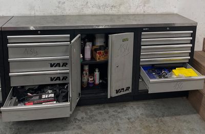 an image of a workbench with a lot of drawers