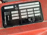 a close up of a sign on the side of a red truck