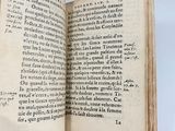 a book open on a table with a white background