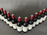 a group of bottles of wine are arranged in the shape of a v