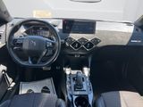 the interior of a car with a steering wheel, dashboard, and dashboard controls