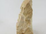 a rock that has a rope around it and is on a white surface