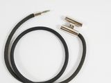 a close up of a pair of black leather cords on a white surface