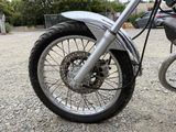 a close up of a motorcycle parked in a parking lot