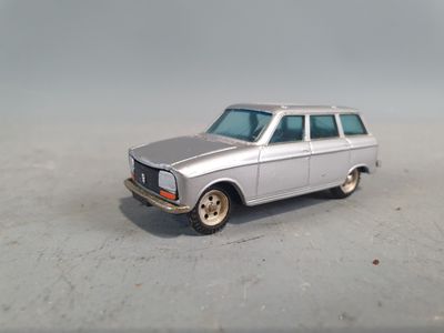 a silver toy car that is sitting on the ground