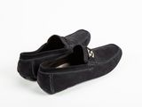 a pair of black sued shoes on a white background