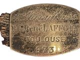 an image of a gold ring with the name of a man