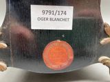a black clock with a red button on it