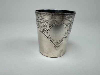 a silver cup that has a heart on it