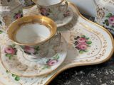 a tray with a tea set on it on a table