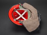 a red fire helmet with a white cross on it
