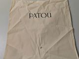 une image représentant un sac en papier sur lequel est inscrit le mot « Patou »