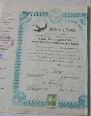 an old document with a bird on it sitting on a table
