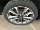 a close up of a tire on a car ' s rim