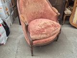 a chair that is sitting in the middle of a pile of boxes