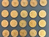 a close up of a bunch of coins sitting on top of a table
