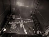 a black and white photo of a kitchen with a sink