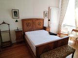 a bed with a wooden headboard and foot board in a room