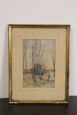 tableau encadré d'une peinture d'un paysage avec des arbres au premier plan