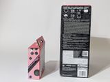 a pink box and a black box on a white surface