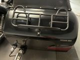 a motorcycle that is parked inside of a garage