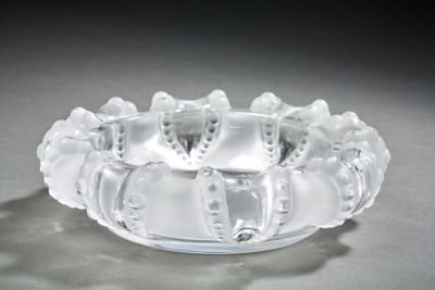 a glass bowl that has a bunch of cats on it