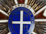 an image of a blue and white star with a cross on it