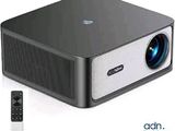 an image of a projector with a remote and a remote control