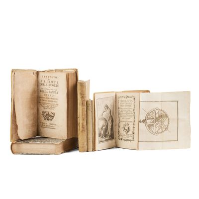 three old books are sitting on top of each other on a white surface