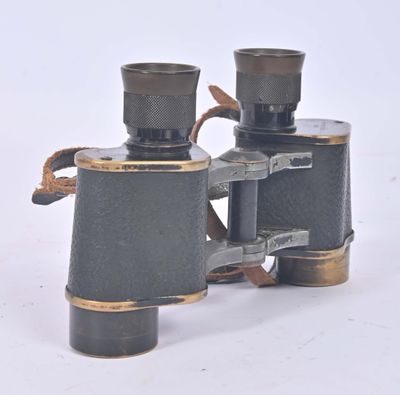 a pair of binoculars sitting on a white surface